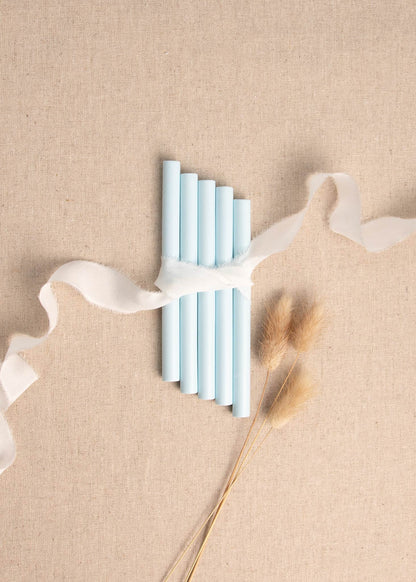 5 pack of Light Blue wax seal sticks surrounded by white silk ribbon and dried flowers