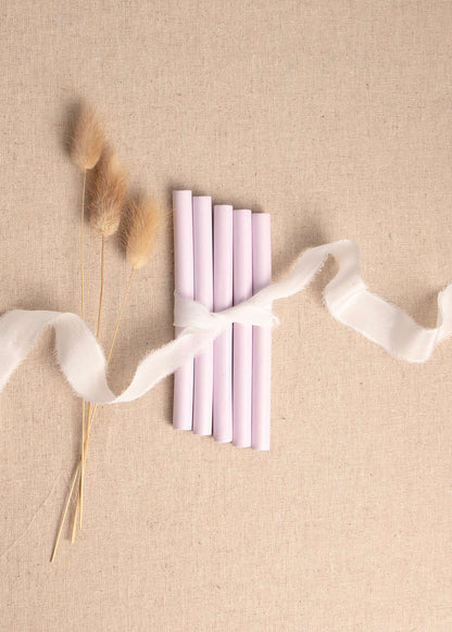 5 pack of Light Pink wax seal sticks surrounded by white silk ribbon and dried flowers