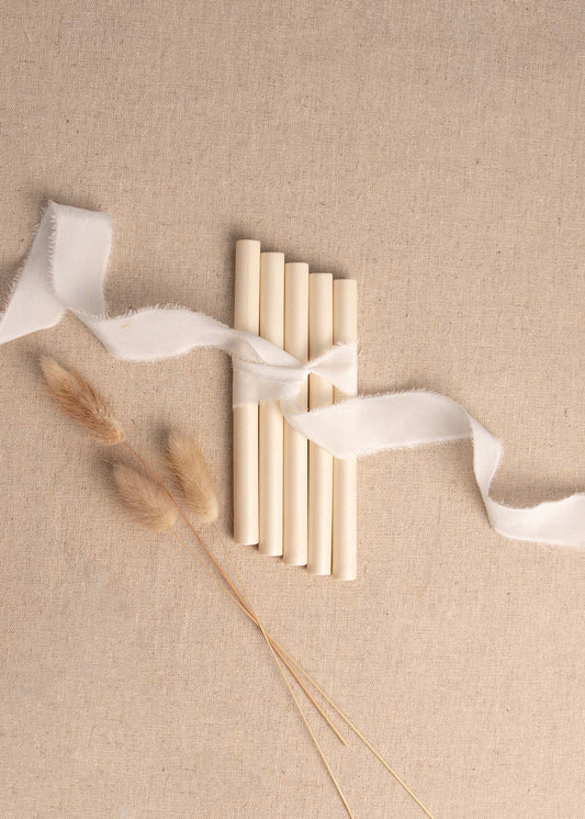 Pearl Cream wax seal sticks tied together with white ribbon and dried flowers 