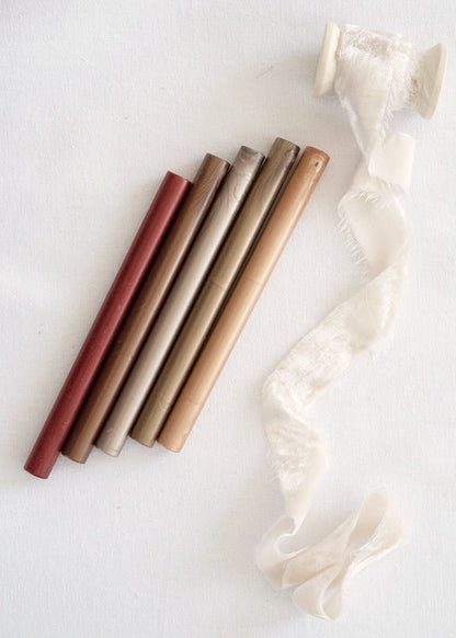 red, bronze, gold wax sealing sticks with white velvet ribbon 
