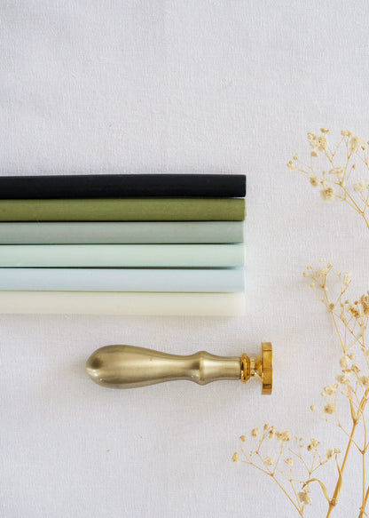 Black, Green, sage, Blue, Vellum wax seal sticks of various colours with stamper and dried flowers