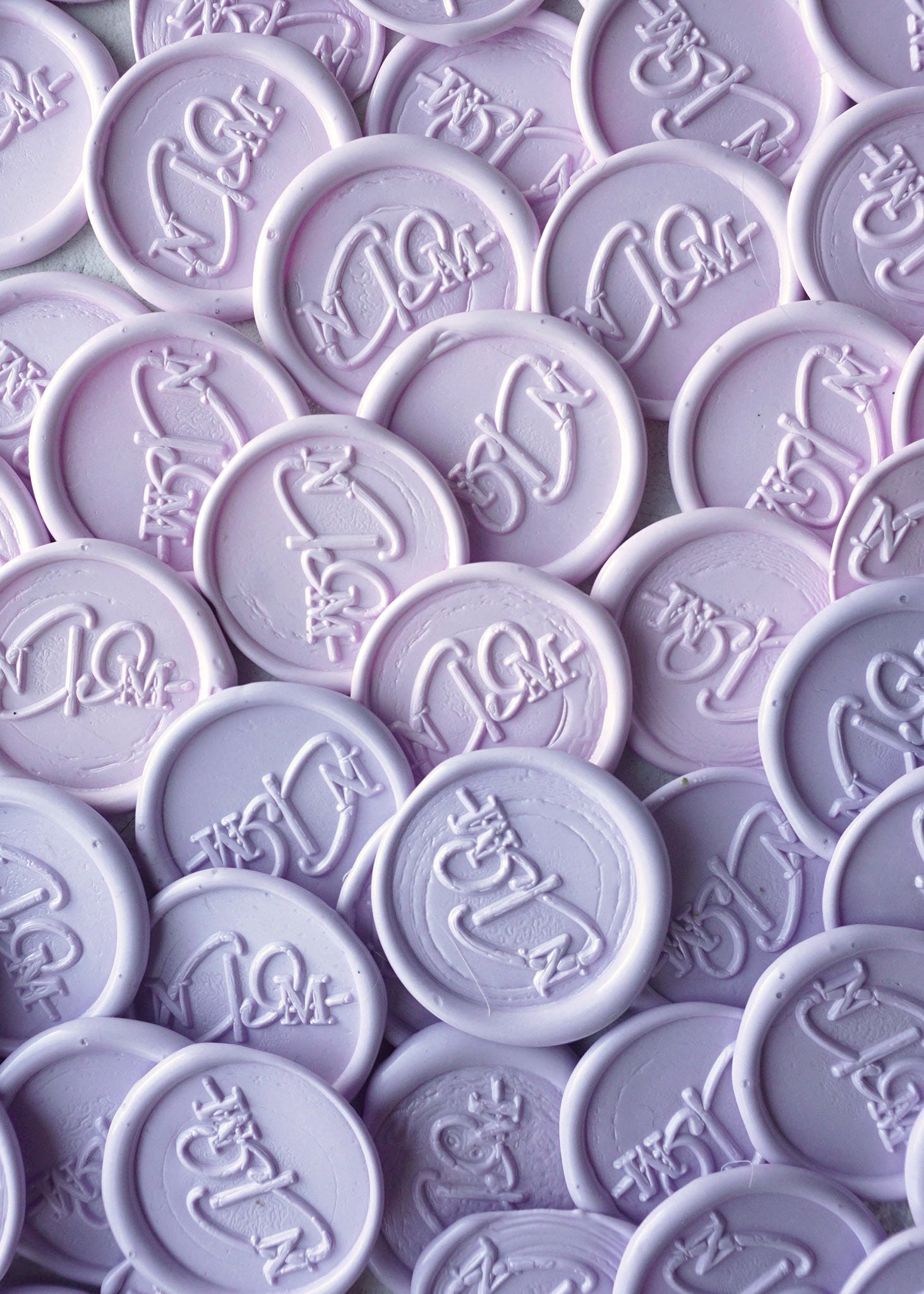 Various shades of purple and lilac wax seal stamps