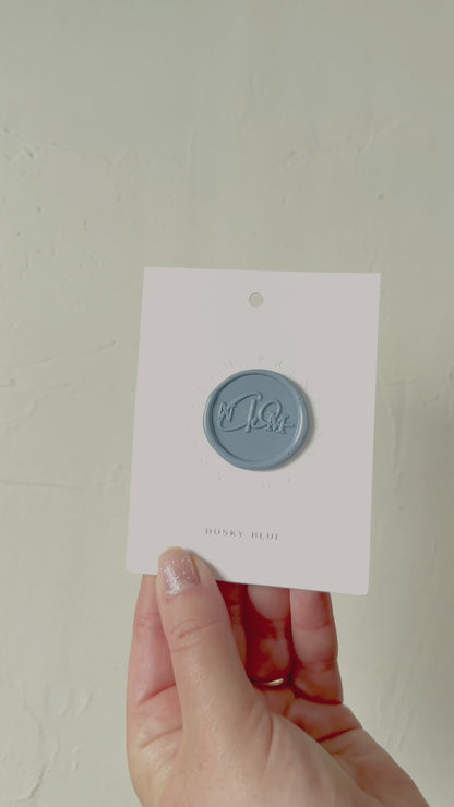 Video of Dusky Blue wax seal stamp sample on textured background