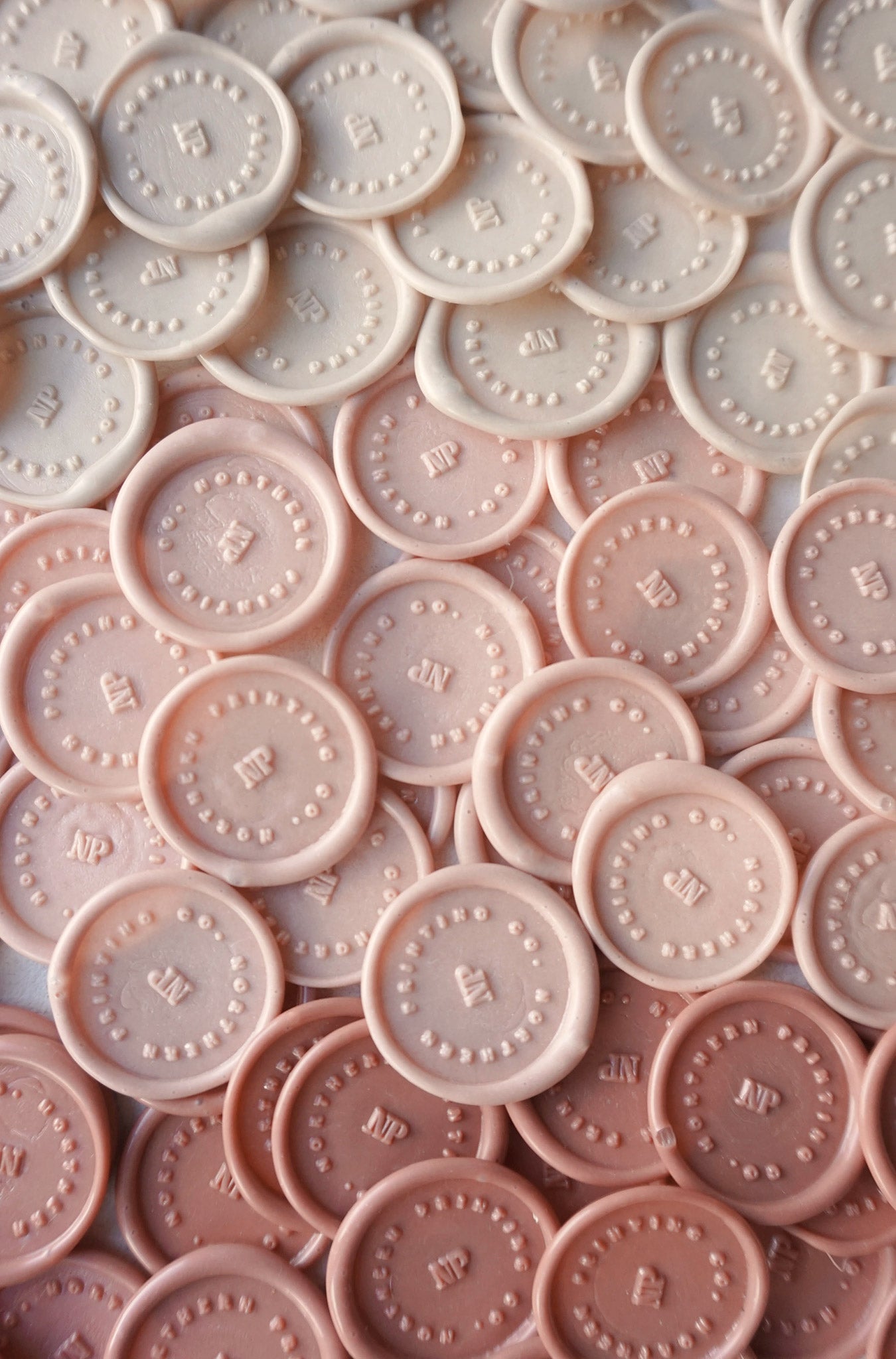 Various shades of pink wax seal stamps